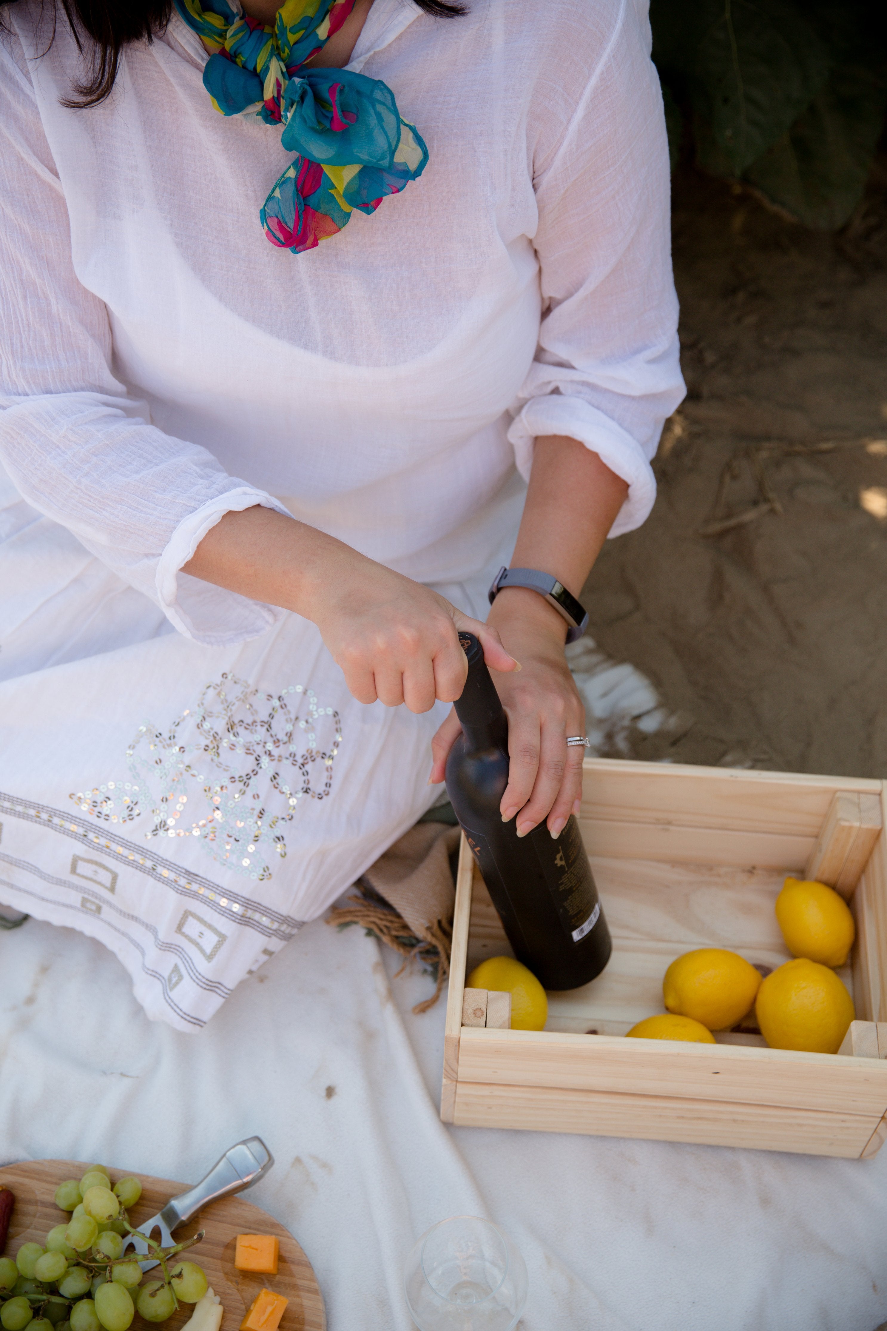 collections/person-opens-bottle-on-a-beach.jpg